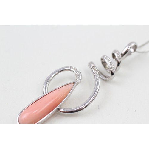 223 - AN 18CT WHITE GOLD DIAMOND ACCENTED TEARDROP CABOCHON CORAL SET DRAMATIC PENDANT NECKLACE, 

Weight:... 