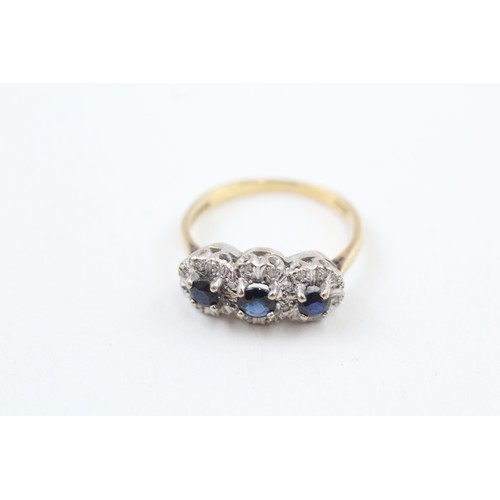 255 - AN 18CT GOLD, SAPPHIRE AND DIAMOND SET TRILOGY CLUSTER RING, 

Weight: 4.0gms