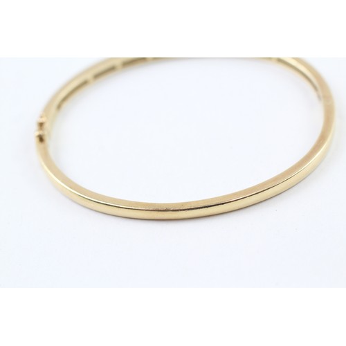 226 - AN 18CT GOLD CHANNEL SET ROUND BRILLIANT DIAMOND SET BANGLE,

Weight: 18.7gms