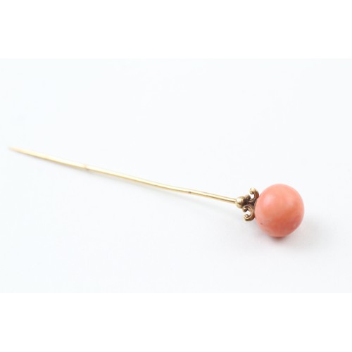 236 - AN 18CT GOLD ANTIQUE CORAL BEAD SET HAIRPIN,

Weight: 5.4gms