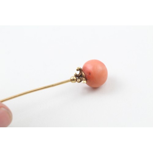 236 - AN 18CT GOLD ANTIQUE CORAL BEAD SET HAIRPIN,

Weight: 5.4gms