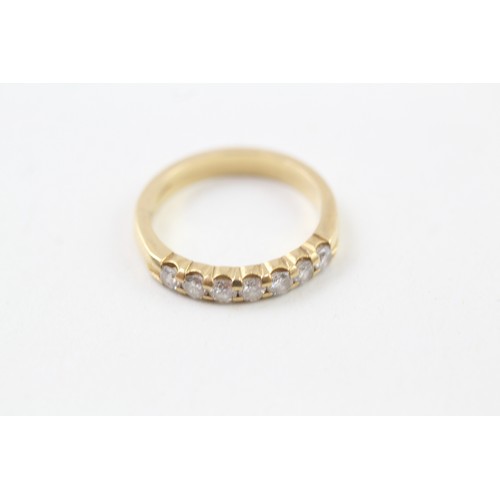 239 - AN 18CT GOLD ROUND BRILLIANT DIAMOND SET SEVEN STONE ETERNITY RING, 

Weight: 4.1gms