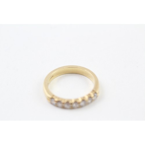 239 - AN 18CT GOLD ROUND BRILLIANT DIAMOND SET SEVEN STONE ETERNITY RING, 

Weight: 4.1gms