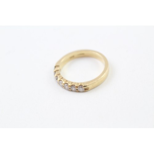 239 - AN 18CT GOLD ROUND BRILLIANT DIAMOND SET SEVEN STONE ETERNITY RING, 

Weight: 4.1gms