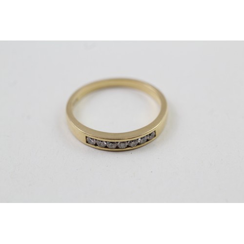 245 - AN 18CT GOLD ROUND BRILLIANT DIAMOND SEVEN STONE ETERNITY RING, 

Weight: 3.5gms