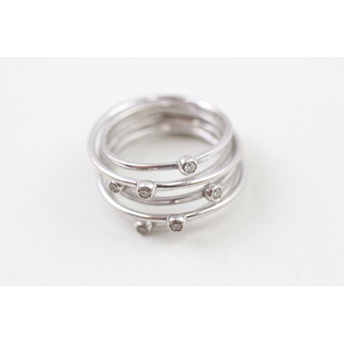 251 - AN 18CT WHITE GOLD DIAMOND ACCENTED WIRE WRAP RING, 

Weight: 6.6gms