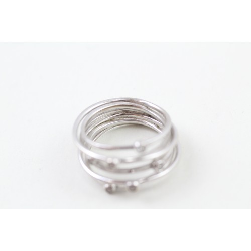 251 - AN 18CT WHITE GOLD DIAMOND ACCENTED WIRE WRAP RING, 

Weight: 6.6gms