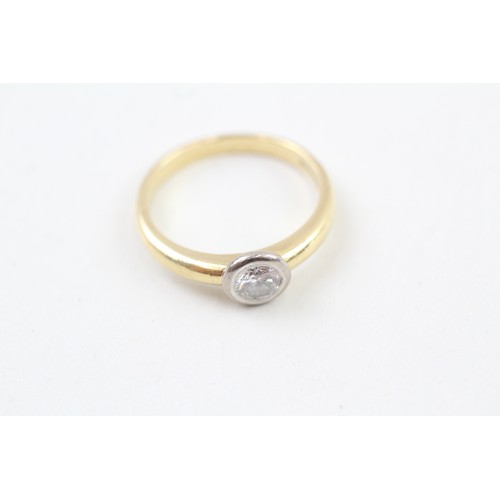 252 - AN 18CT GOLD, WHITE AND YELLOW GOLD RUB OVER SET DIAMOND SOLITAIRE RING, 

Weight: 4.2gms