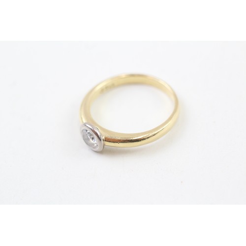 252 - AN 18CT GOLD, WHITE AND YELLOW GOLD RUB OVER SET DIAMOND SOLITAIRE RING, 

Weight: 4.2gms