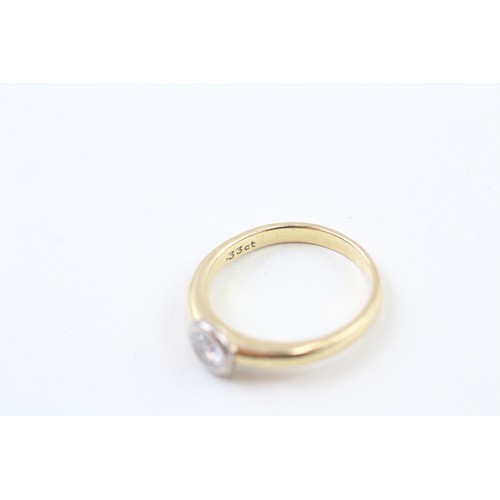 252 - AN 18CT GOLD, WHITE AND YELLOW GOLD RUB OVER SET DIAMOND SOLITAIRE RING, 

Weight: 4.2gms