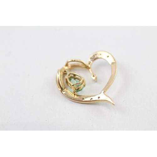 264 - AN 18CT GOLD, DIAMOND AND TOURMALINE HEART PENDANT, 

Weight: 2.1gms