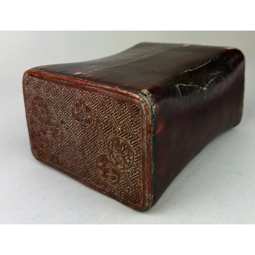290 - A JAPANESE RED CINNABAR LACQUERED PILLOW, 

18cm x 13cm x 8cm
