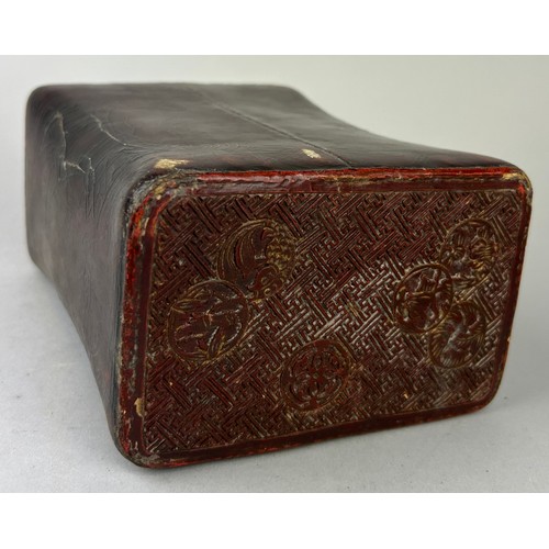 290 - A JAPANESE RED CINNABAR LACQUERED PILLOW, 

18cm x 13cm x 8cm