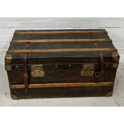 757 - A LEATHER AND BRASS BOUND TRAVEL TRUNK, 

80cm x 43cm x 41cm