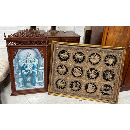 810 - A CARVED SOUTH EAST ASIAN WOODEN FRAME ALONG WITH A SOUTH EAST ASIAN METAL THREAD EMBROIDERED PANEL,... 