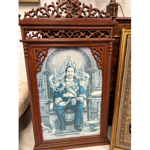 810 - A CARVED SOUTH EAST ASIAN WOODEN FRAME ALONG WITH A SOUTH EAST ASIAN METAL THREAD EMBROIDERED PANEL,... 