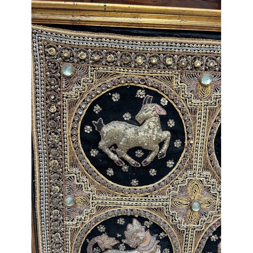 810 - A CARVED SOUTH EAST ASIAN WOODEN FRAME ALONG WITH A SOUTH EAST ASIAN METAL THREAD EMBROIDERED PANEL,... 