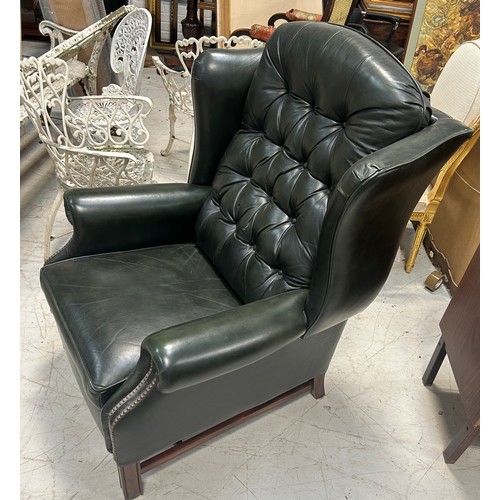 765 - A GREEN LEATHER BUTTON BACK RECLINING ARMCHAIR, 

110cm x 83cm x 83cm