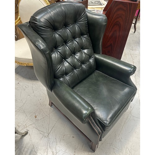 765 - A GREEN LEATHER BUTTON BACK RECLINING ARMCHAIR, 

110cm x 83cm x 83cm