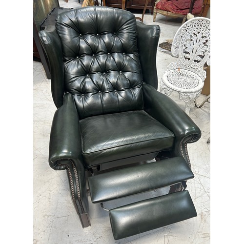 765 - A GREEN LEATHER BUTTON BACK RECLINING ARMCHAIR, 

110cm x 83cm x 83cm