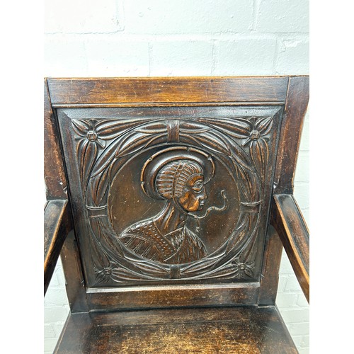 769A - AN OAK WAINSCOT DESIGN CHAIR WITH CARVED BACK PANEL DEPICTING A LADY, 

100cm x 55cm x 55cm