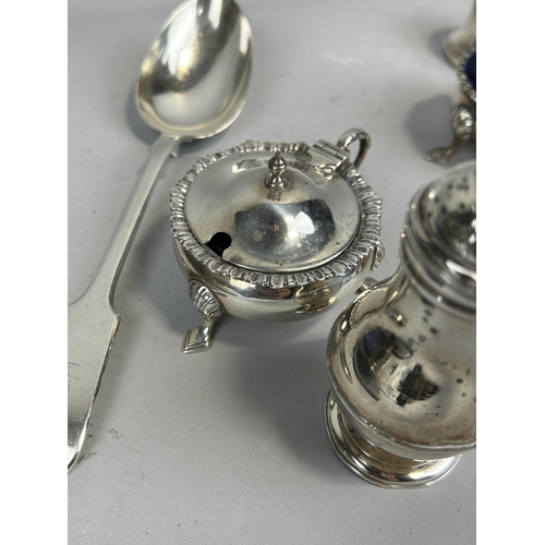 19 - A COLLECTION OF SILVER ITEMS TO INCLUDE A SERVICE SPOON, SALTS, SPOONS ETC Total weighable silver we... 