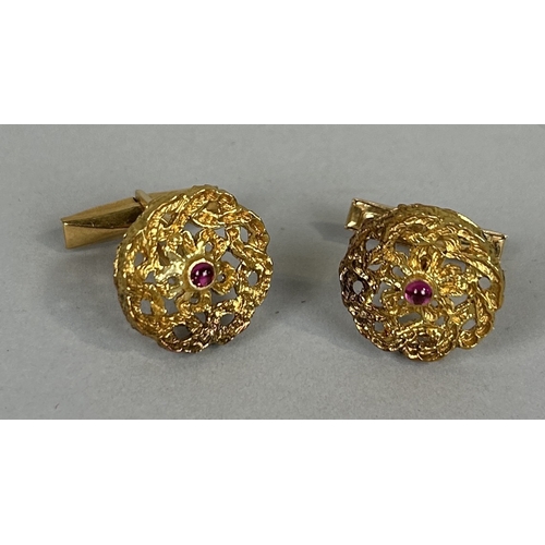 61 - A PAIR OF 18CT GOLD CUFFLINKS EACH SET WITH A SINGLE RUBY Weight: 11.4gms Marked 18K