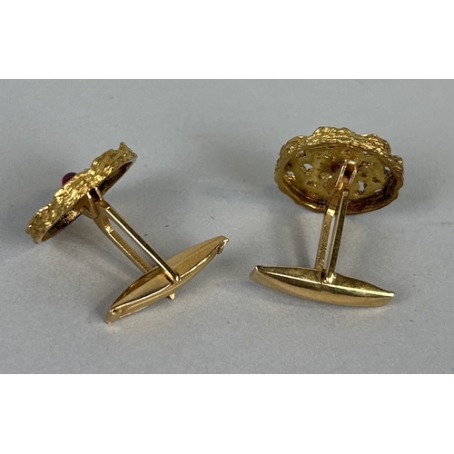 61 - A PAIR OF 18CT GOLD CUFFLINKS EACH SET WITH A SINGLE RUBY Weight: 11.4gms Marked 18K