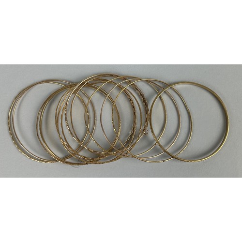 9 - A COLLECTION OF THIRTEEN CHINESE GOLD BANGLES MARKED 22CT OR 90% (13) Weight: 80gms