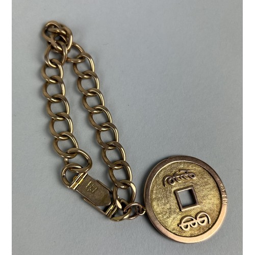 15 - A CHINESE 18CT GOLD CHAIN LINK BRACELET WITH CURRENCY CHARM Weight: 34.6gms