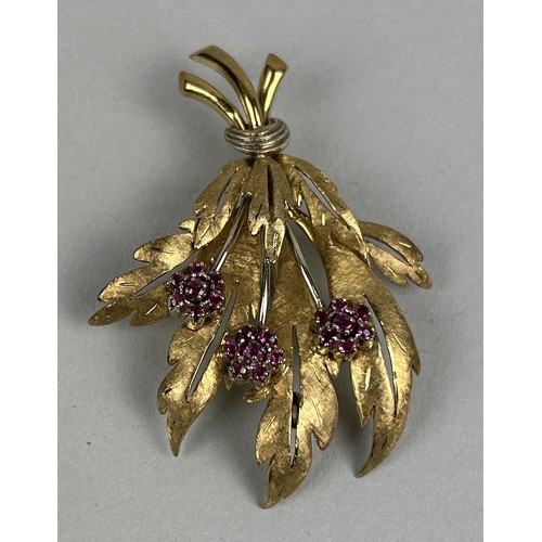 22 - AN 18CT GOLD FLORAL BROOCH SET WITH RUBIES Weight: 13.1gms