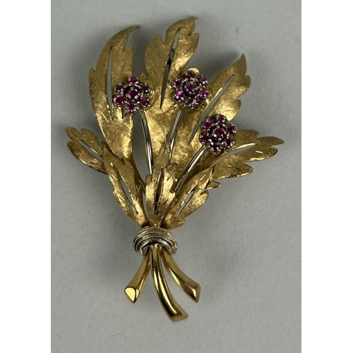 22 - AN 18CT GOLD FLORAL BROOCH SET WITH RUBIES Weight: 13.1gms