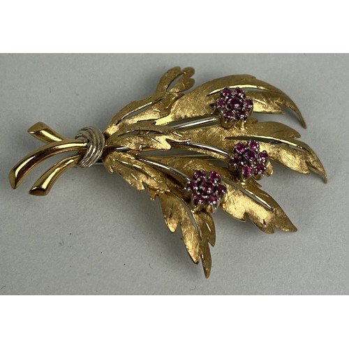 22 - AN 18CT GOLD FLORAL BROOCH SET WITH RUBIES Weight: 13.1gms