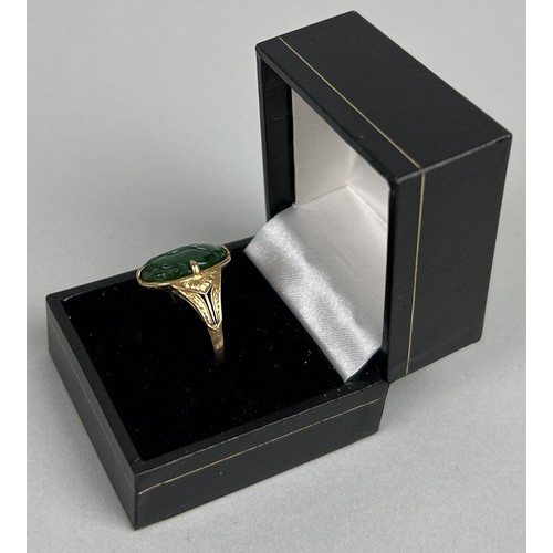 21 - A CHINESE 14CT GOLD RING SET WITH JADE BEZEL 4.1gms