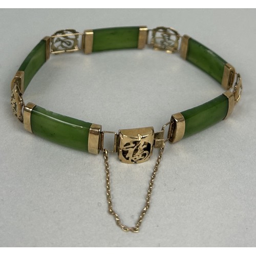 25 - A CHINESE 14CT GOLD AND JADE BRACELET Weight: 12.6gms