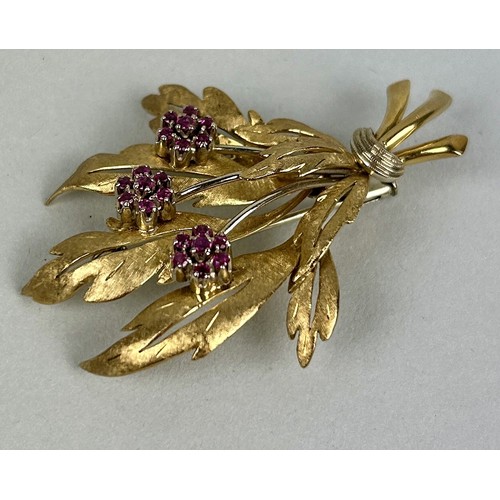 22 - AN 18CT GOLD FLORAL BROOCH SET WITH RUBIES Weight: 13.1gms