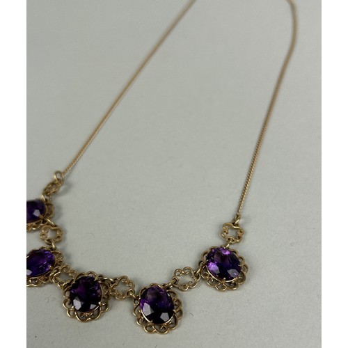 27 - A 9CT GOLD AND AMETHYST NECKLACE Weight: 8.9gms