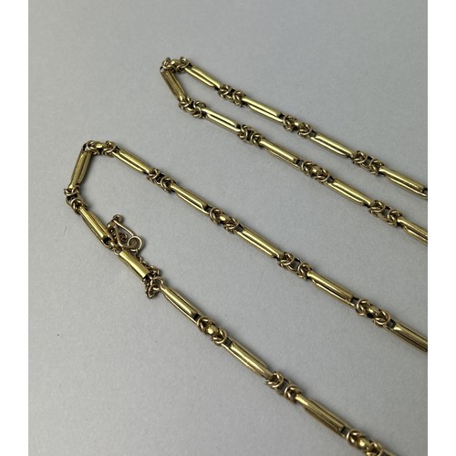 33 - AN 18CT GOLD VICTORIAN LADIES CHAIN 59gms 67cm L