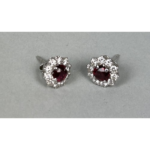 52 - A PAIR OF WHITE GOLD CLUSTER EARRINGS EACH SET WITH A RUBY AND TEN DIAMONDS Weight: 2.6gms