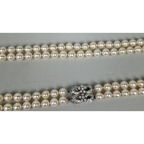 50 - A DOUBLE STRAND CULTURED PEARL NECKLACE WITH WHITE GOLD AND DIAMOND CLASP Weight: 92.7gms