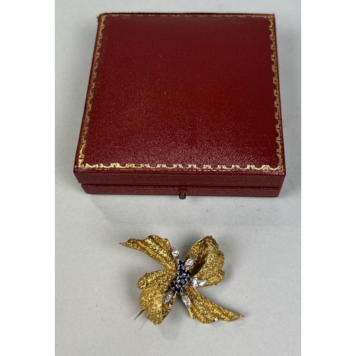 49 - AN 18CT GOLD RIBBON BROOCH SET WITH SAPPHIRES AND DIAMONDS, WITH ASPREY AND CO BOX Weight: 16.8gms