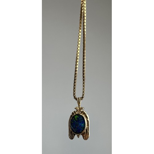 65 - A BLACK OPAL SET IN 9CT GOLD PENDANT WITH 9CT GOLD CHAIN Weight: 9 gms