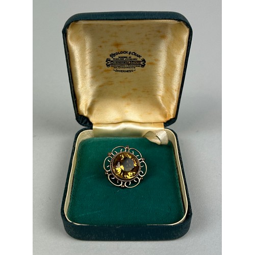 60 - A SCOTTISH 9CT GOLD BROOCH SET WITH A CITRINE Weight: 6.3gms With box from Cairngorm, Inverness.