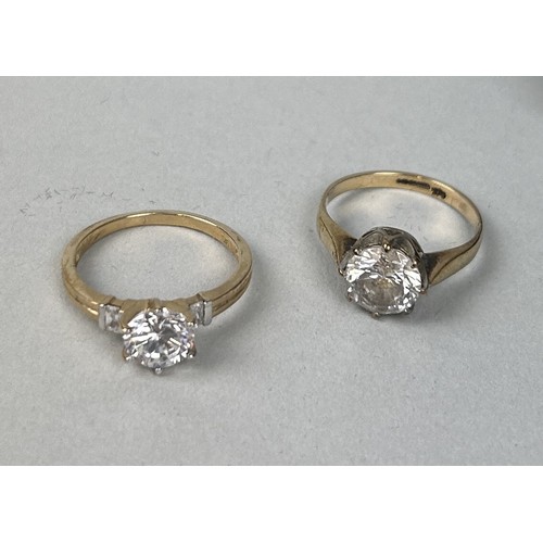 84 - TWO GOLD RINGS SET WITH CLEAR STONES One marked 9k, the other hallmarked but indecipherable. Total w... 