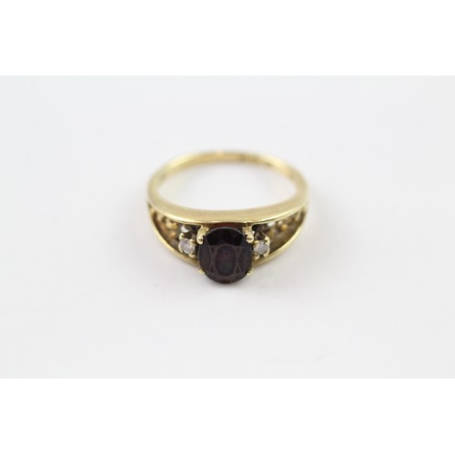 97 - A 14CT GOLD GARNET AND DIAMOND RING Weight: 3.7gms