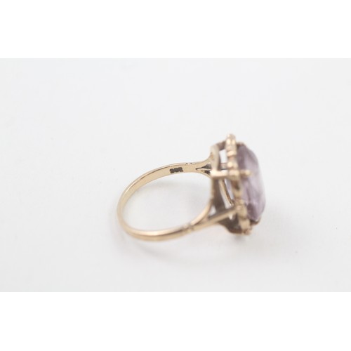 104 - A 9CT GOLD VINTAGE AMETHYST DRESS RING Weight: 4.5gms