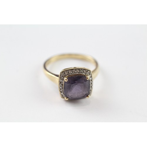 108 - A 9CT GOLD AMETHYST SINGLE STONE RING WITH DIAMOND SURROUND Weight: 3.5gms