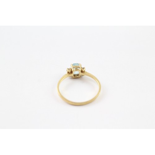 106 - AN 18CT GOLD BLUE TOPAZ AND CUBIC ZIRCONIA DRESS RING Weight: 1.6gms