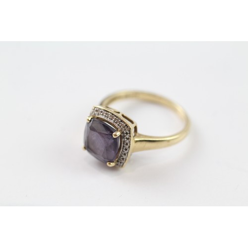 108 - A 9CT GOLD AMETHYST SINGLE STONE RING WITH DIAMOND SURROUND Weight: 3.5gms