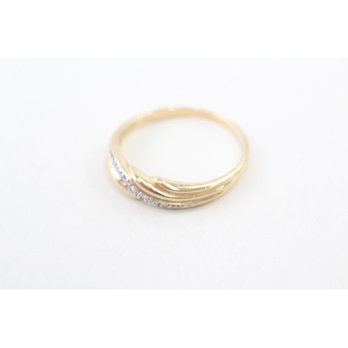 114 - A 9CT GOLD DIAMOND ROW RING Weight: 2.5gms